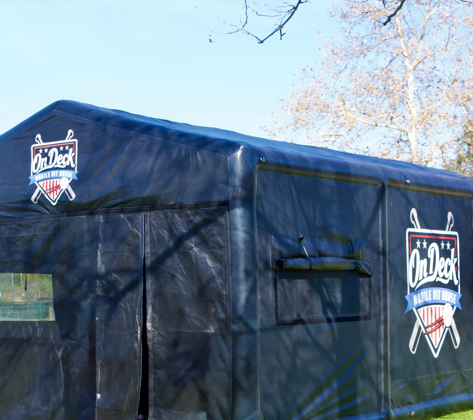 The full On Deck hit house set up on an open field